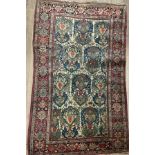 An antique Persian rug with geometric design to bo