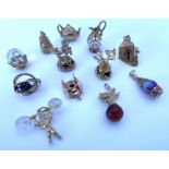 A collection of good 9ct gold charms (11), overall