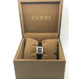 A boxed Gucci ladies dress watch with manual.