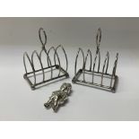 A pair of matching hallmarked silver toast racks t