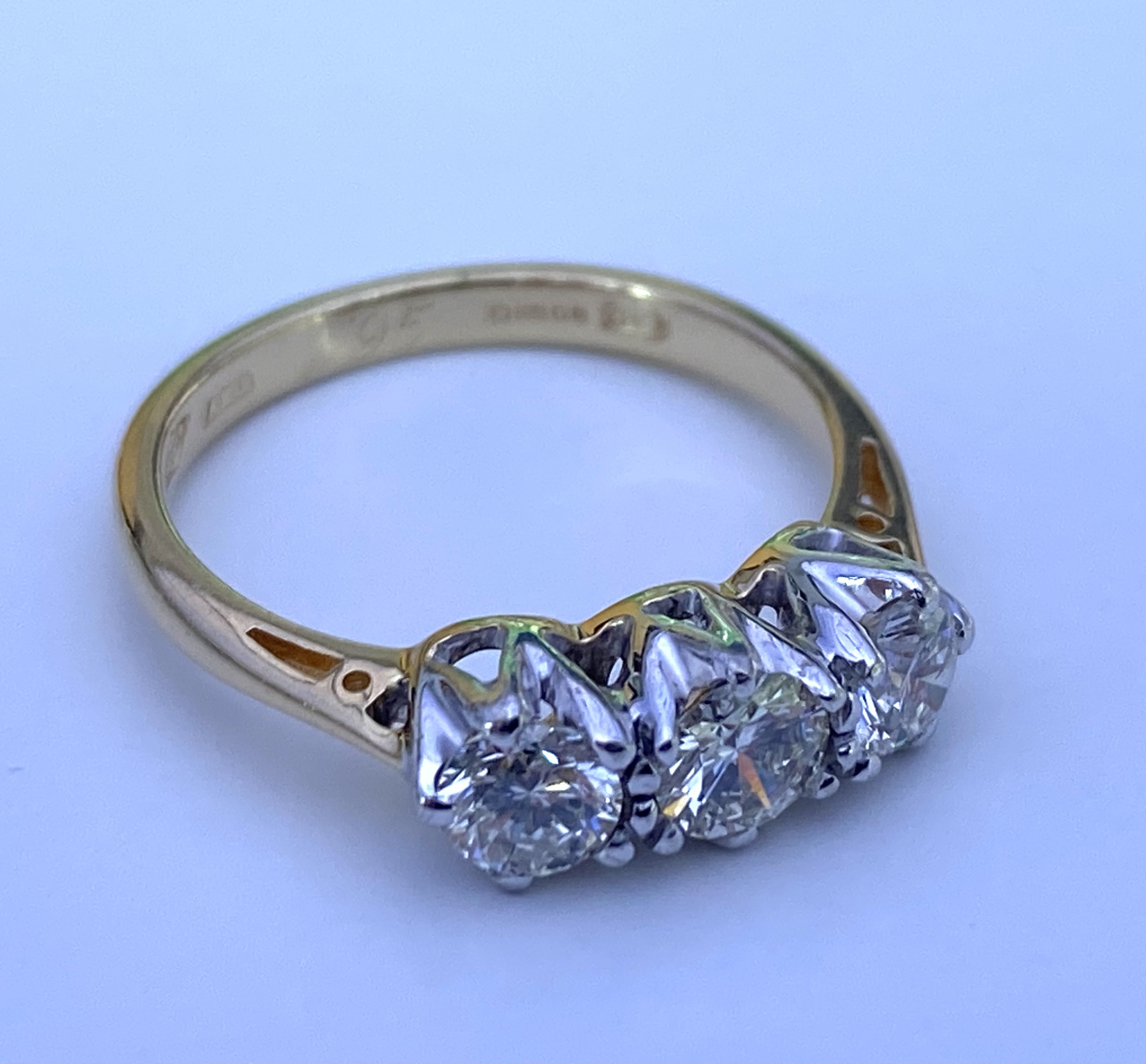 A Certificated 18ct white and yellow gold 3 stone