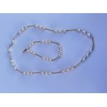 A matching cultured Pearl necklace and bracelet in