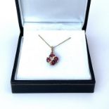 A 9ct yellow gold ruby and diamond necklace.