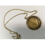 A full gold sovereign on chain 15 grams.