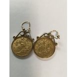 A pair of gold earrings inset with half sovereigns
