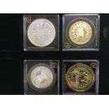 Four silver and gold plated proof coins from the M