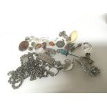 A collection of silver jewellery including an ingo