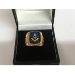 A gents gold ring inset with Masonic symbol.