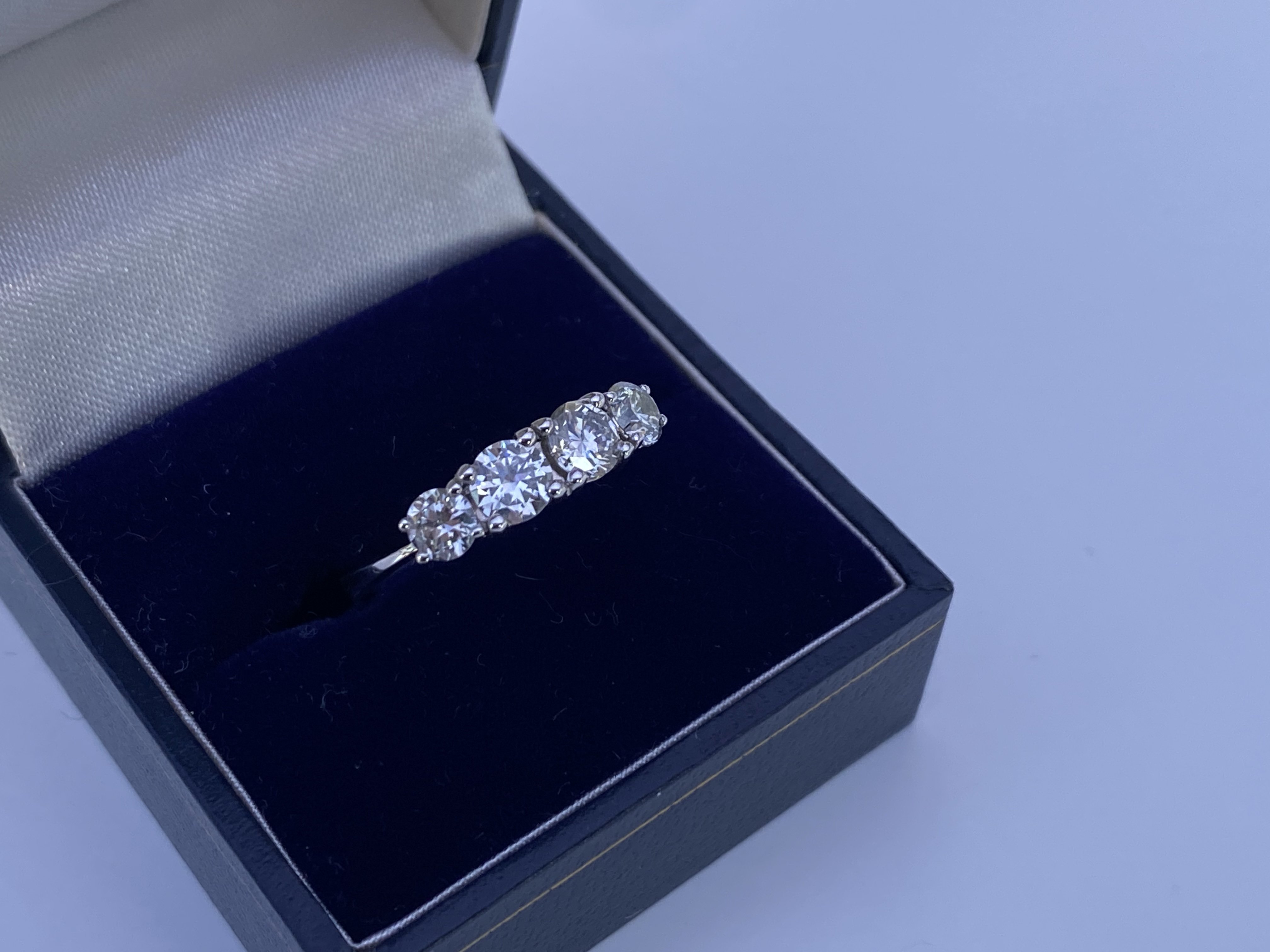 An 18ct white gold 4 stone RBC 1.30ct diamond ring