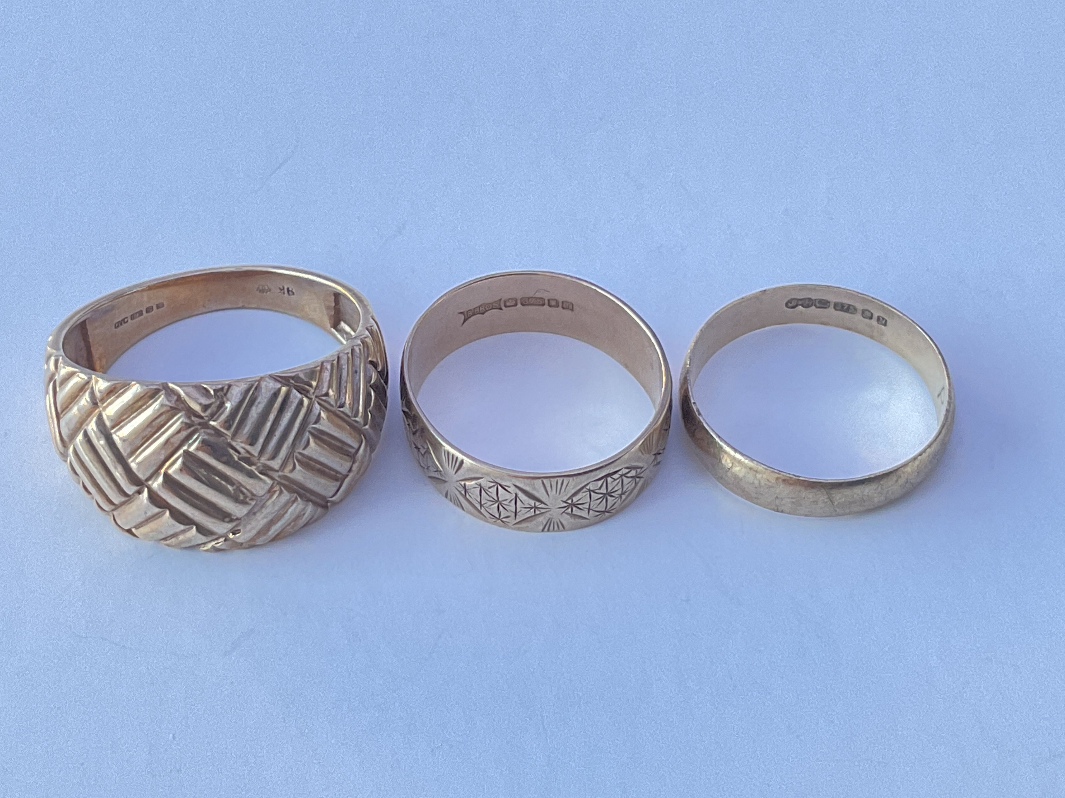 Two 9ct gold rings & a 9ct gold weave design ring.