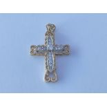 9ct gold & white stone set cross. Approx 6g.