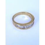 An 18ct yellow gold half eternity style channel se