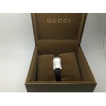 A boxed Gucci ladies dress watch with manual.