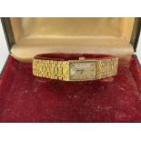 A boxed heavy 9ct gold Longines wrist watch. Appro