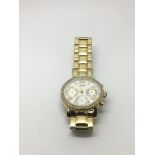 A Guess ladies gold tone chronograph watch.