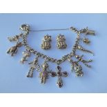 9ct charm bracelet and two cat charms. Approx 42g.