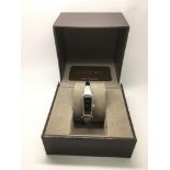 A boxed Gucci ladies bangle watch.