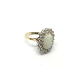 A gold opal and diamond cluster ring, approx 8.2g