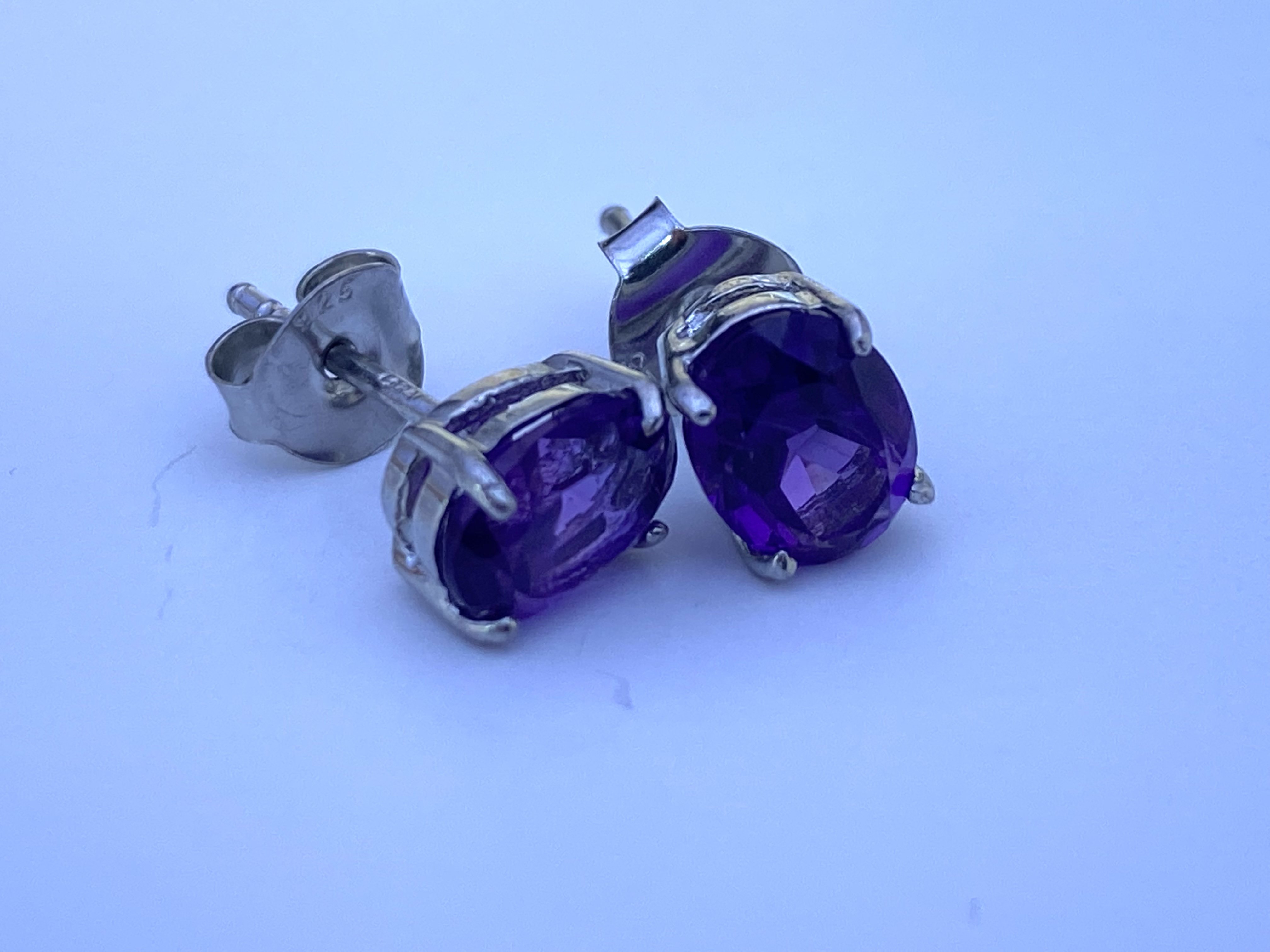 A pair of sterling silver and Amethyst stud earrin