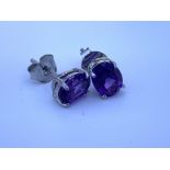 A pair of sterling silver and Amethyst stud earrin