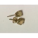 A pair of 9 ct gold stud earrings inset with opals