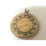 A 1918 gold Sovereign in a 9ct gold pendent mount.