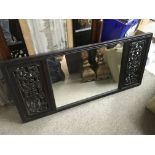 A hardwood framed Chinese wall mirror, approx 93cm x 43cm.