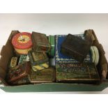 A box containing vintage tins.