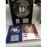 Five framed and glazed silver and gold discs recog