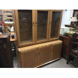 A Errol display cabinet fitted with three glazed d