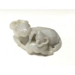 A Chinese carved white jade buffalo.