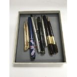 A small collection of vintage pens and propelling