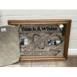 A vintage Black & White Scotch whisky mirror together with a 1950s mirror with a leaping deer