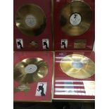 Seven framed and glazed gold and silver discs reco