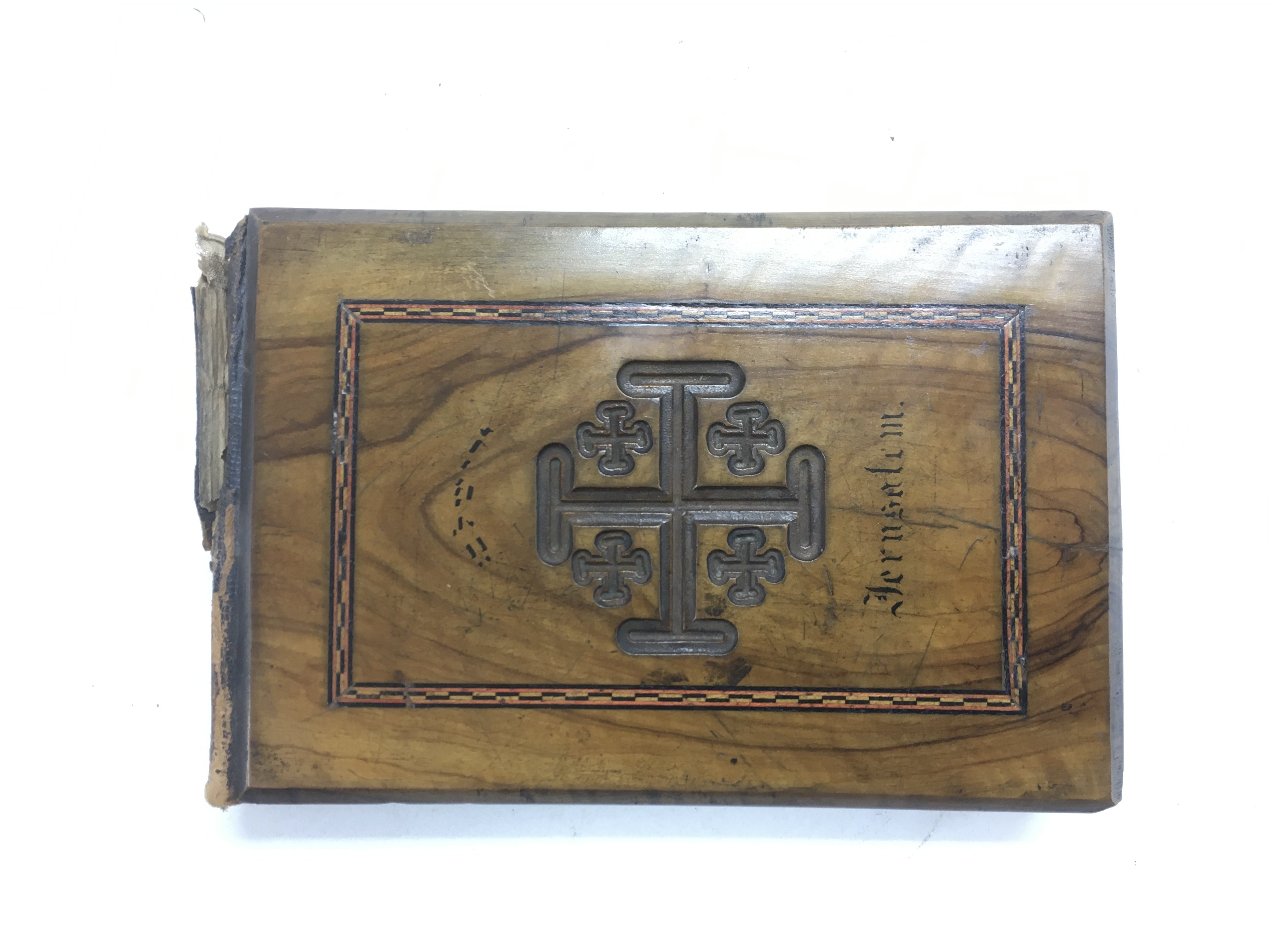 An olive wood bound pictorial book of Jerusalem.