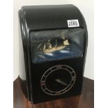 A Vitascope clock in Bakelite case with Ship diora