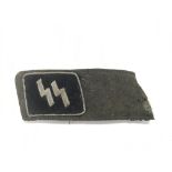 A Waffen SS collar fragment.