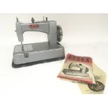 A Vintage Essex Miniature sewing machine with inst