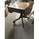 A Quality Regency Mahogany table the twin flap top above a single drawer on a turned coloum and well