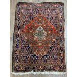 A 20thC hand knotted Persian rug. 160 x 114cm