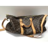 A Louis Vuitton large weekend hold-all travel bag,