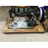 A vintage Harris No.9 cased sewing machine.