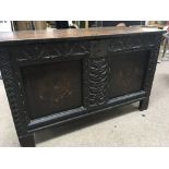 A late 17th or Early 18th Century chest coffer with a hinged top above inlaid and carved panels.