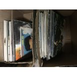 A collection of 1970s and 1980s LPs.