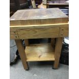 A Butchers block set in a pine table. 70cmx50cm