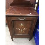 An Edwardian coal box inlaid with mother of pearl.