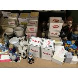 A large collection of Wade figures some in boxes and other Wade Ceramics (a lot)