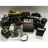 A collection of cameras and lenses including a Rus