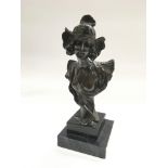 A spelter bust of an Art Nouveau lady raised on a