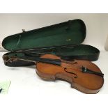An Early 20th century Violin and bow in a wood cas